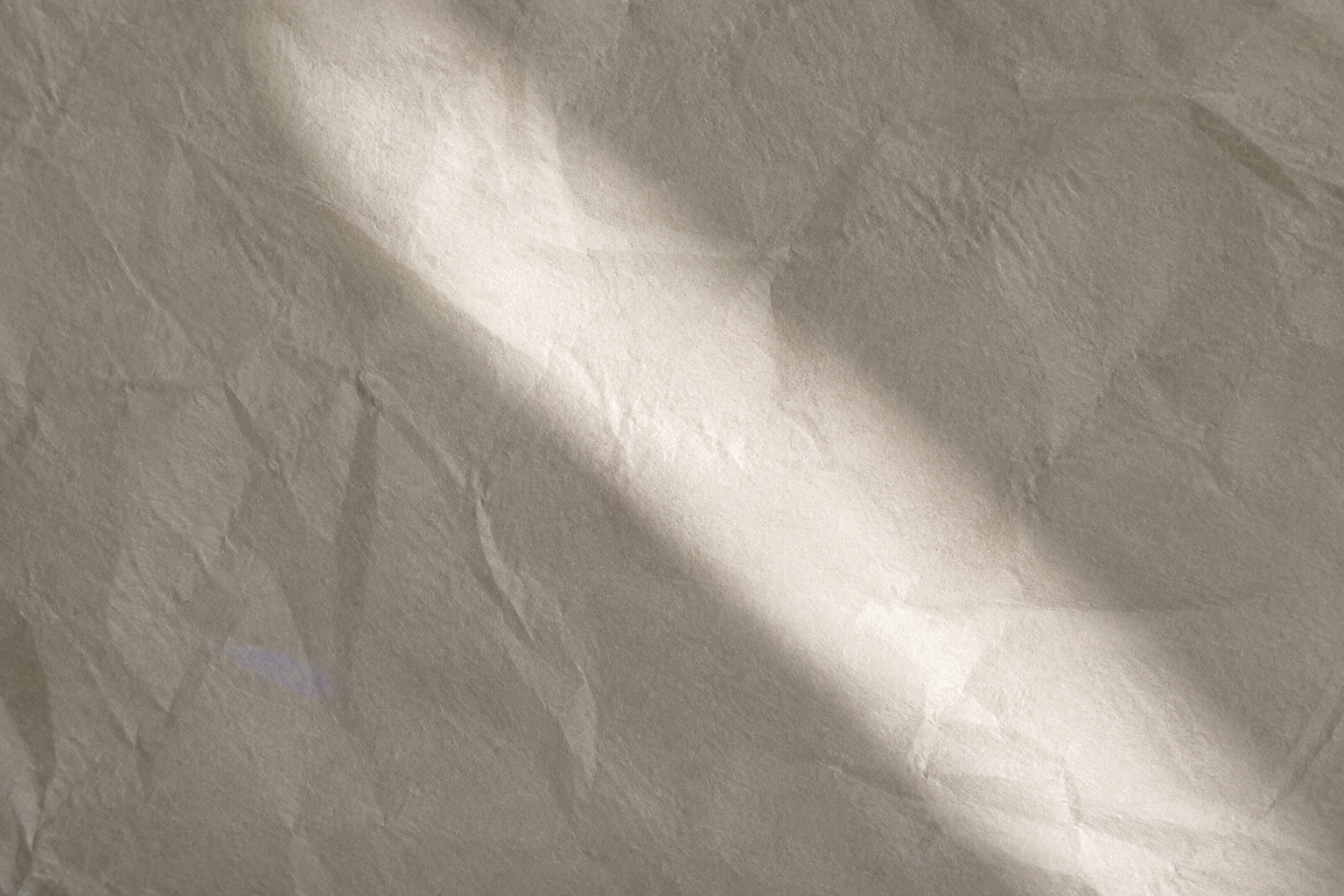 Close detail of folded cotton paper in natural light